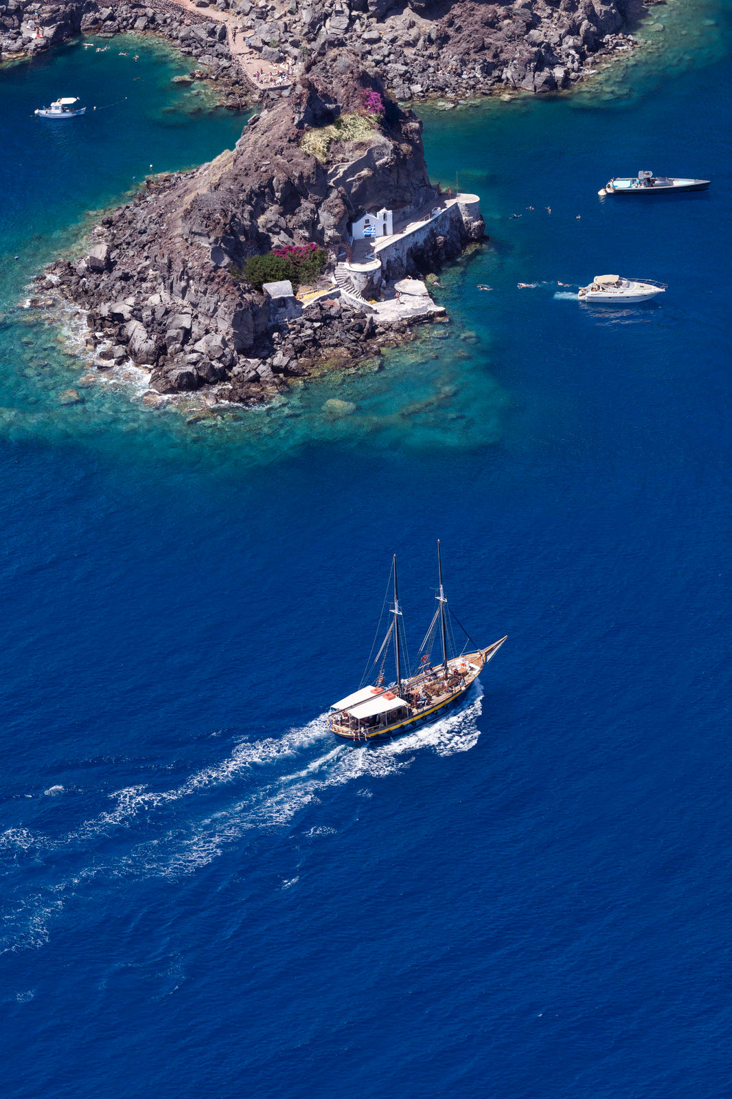 Photography by Gray Malin of Boating Around Oia, Santorini