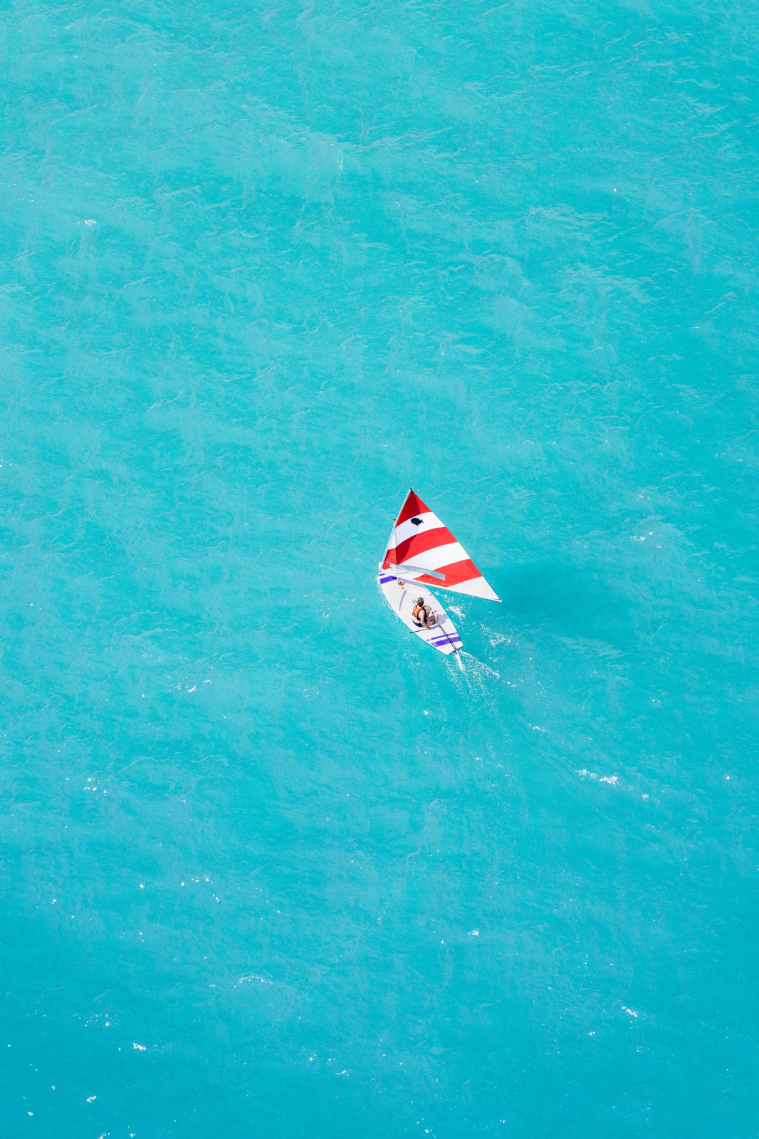 Photography by Gray Malin of Chicago Sunfish Sailboat Vertical
