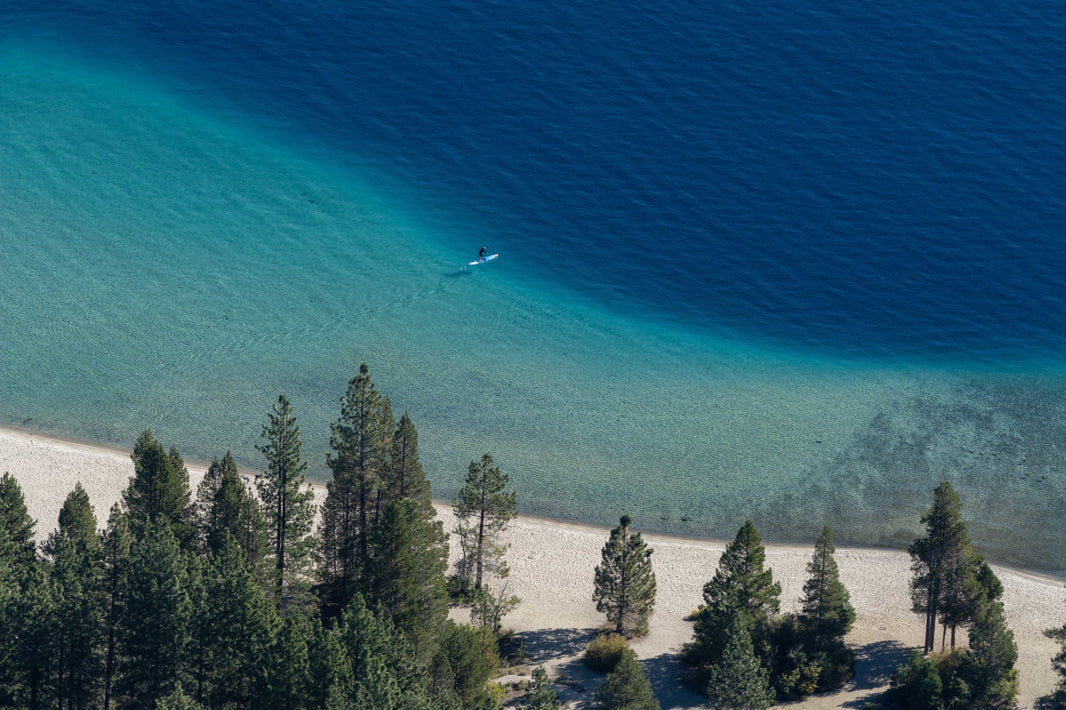Photography by Gray Malin of Meeks Bay Paddleboarder, Lake Tahoe