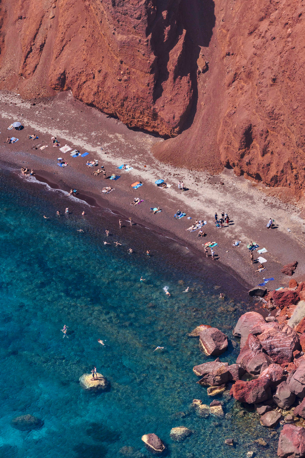 Photography by Gray Malin of Red Beach Vertical, Santorini