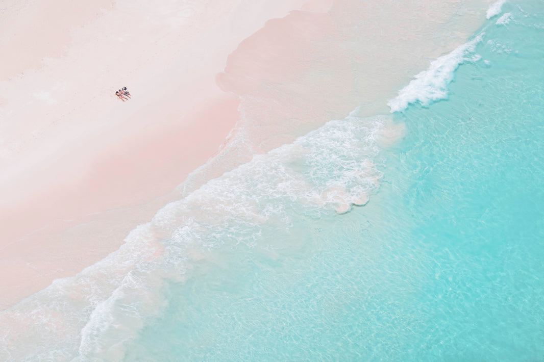 Photography by Gray Malin of Sunbathers, Pink Sand Beach, Harbour Island, Bahamas