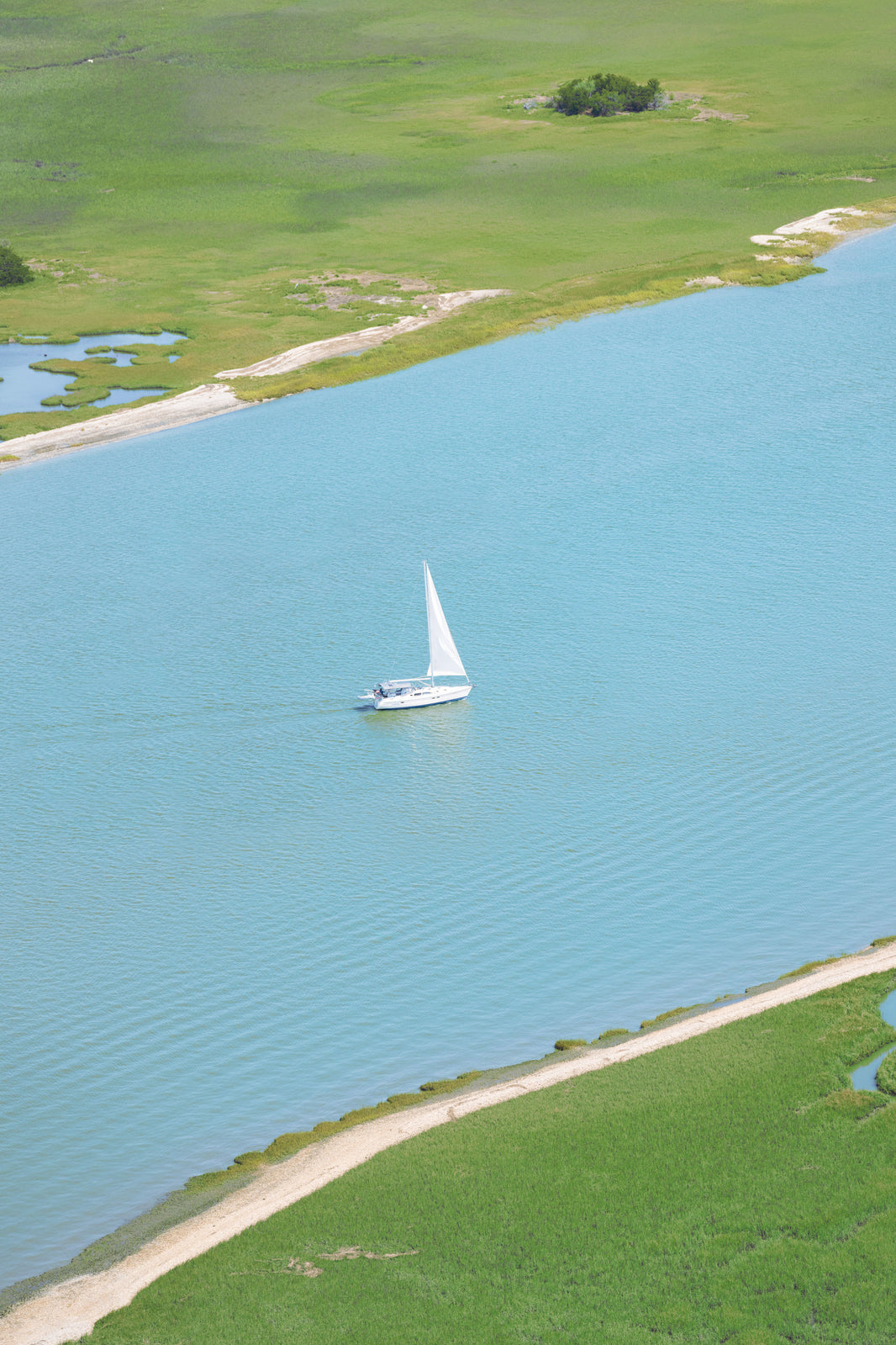 Photography by Gray Malin of The Sailboat Vertical, Charleston, South Carolina