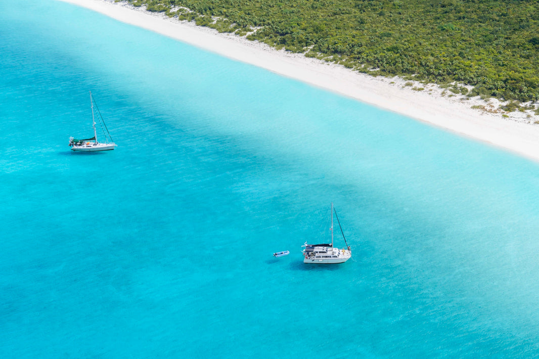 Photography by Gray Malin of Two Boats, Highbourne Cay, Bahamas