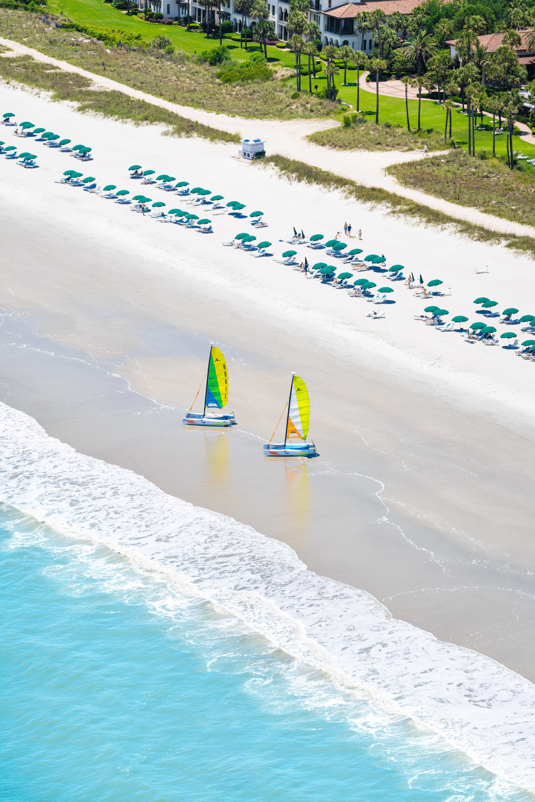 Photography by Gray Malin of Two Sailboats Vertical, The Cloister at Sea Island, Georgia