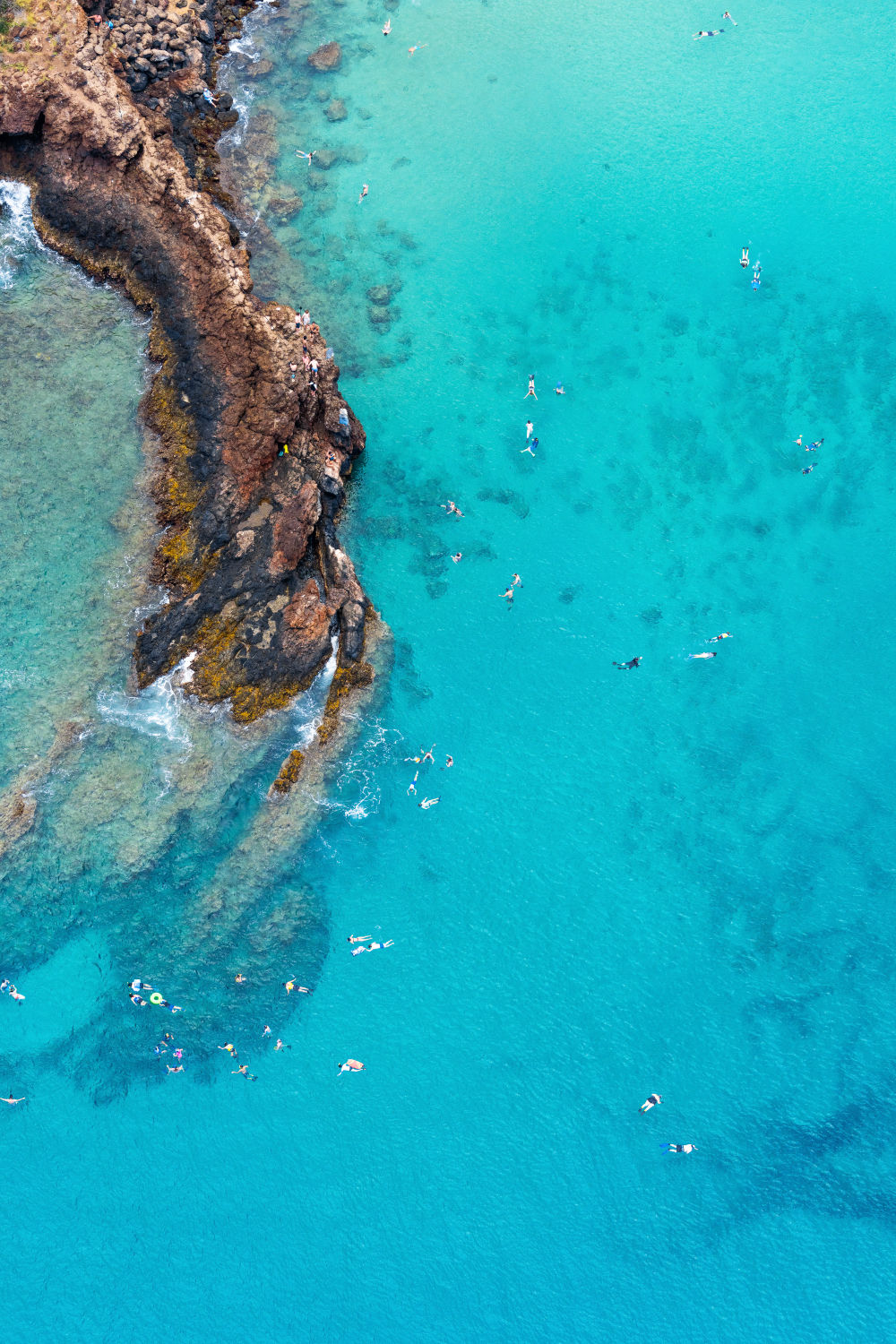Photography by Gray Malin of Black Rock Swimmers, Maui