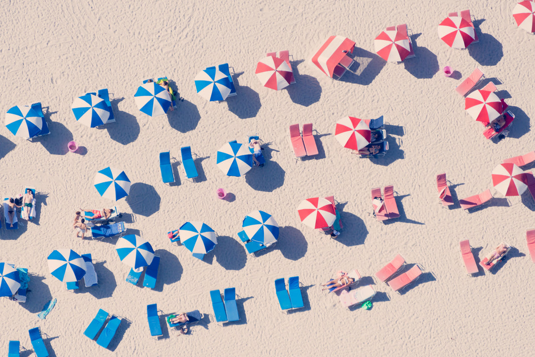 Photography by Gray Malin of Blue and Red Striped Umbrellas