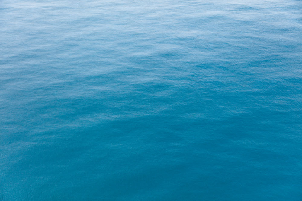 Photography by Gray Malin of Blue Ocean, New Zealand