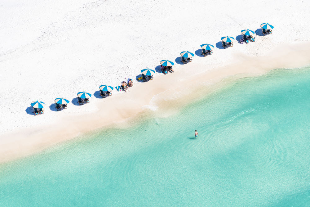 Photography by Gray Malin of Blue and White Striped Umbrellas, Seagrove Beach, 30A Florida