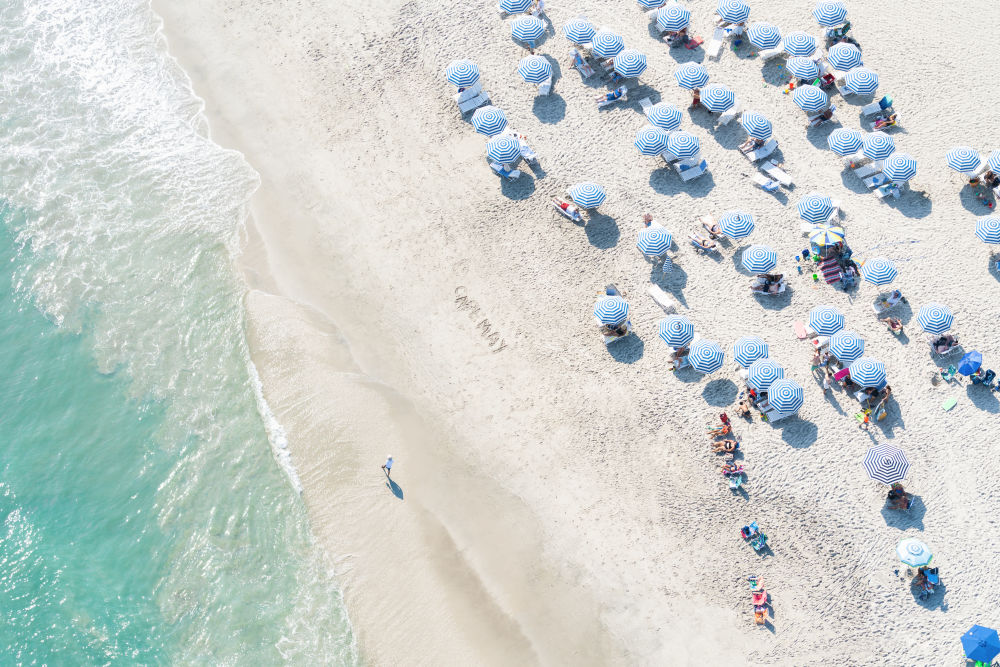 Photography by Gray Malin of Blue and White Umbrellas, Cape May, New Jersey