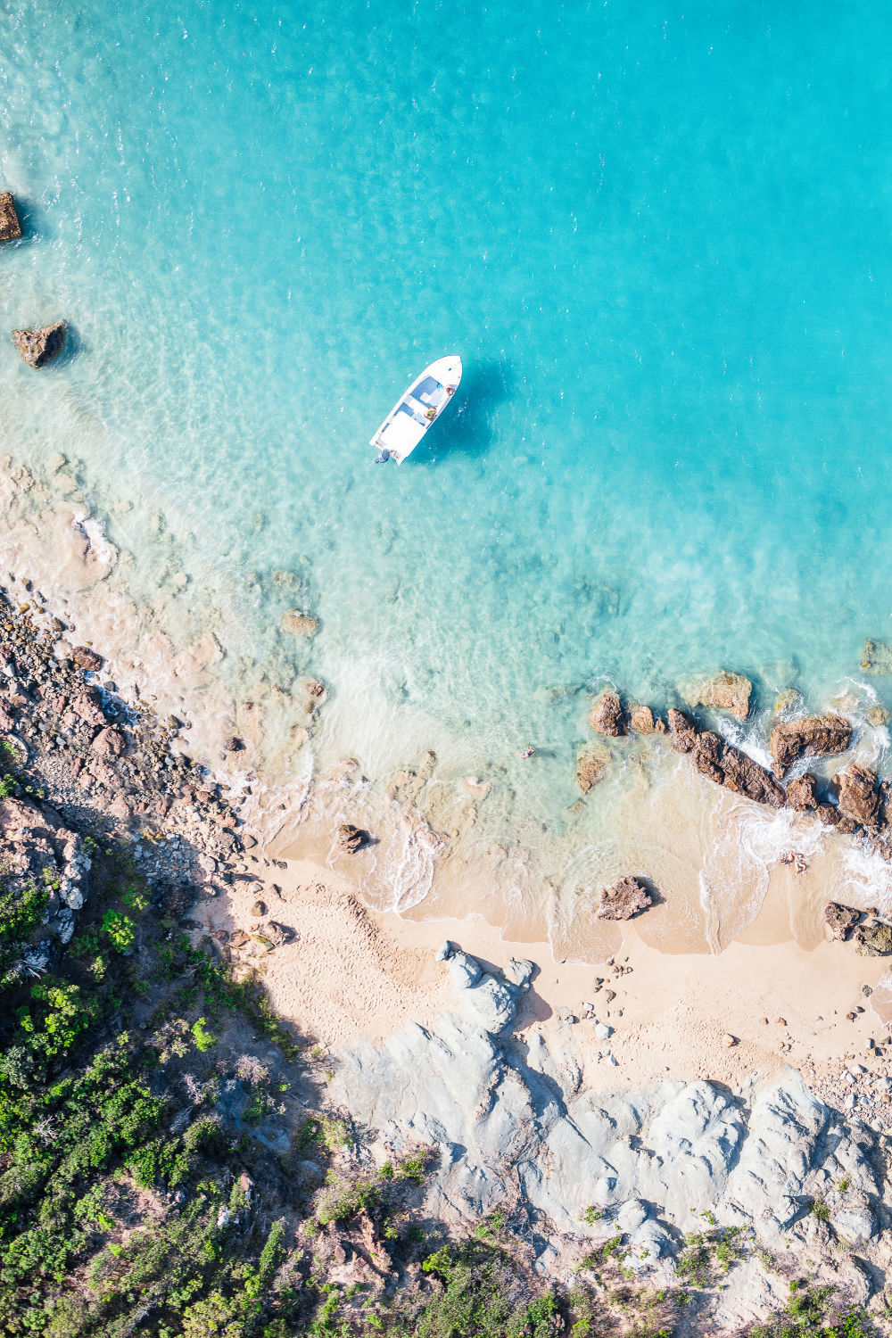 Photography by Gray Malin of Colombier Beach Moored Boat, St. Barths