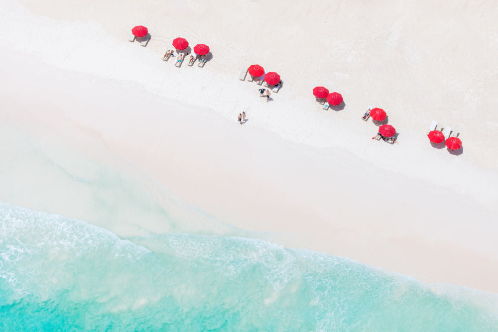 Photography by Gray Malin of Coral Sands Red Umbrellas, Harbour Island