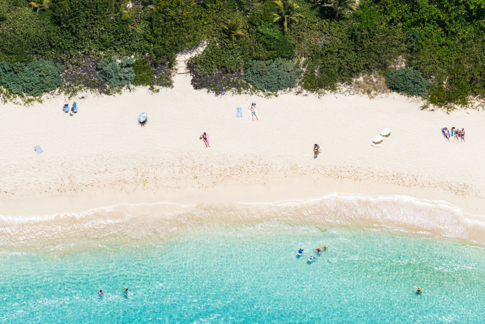 Photography by Gray Malin of Gouverneur Beach Sunbathers, St. Barths