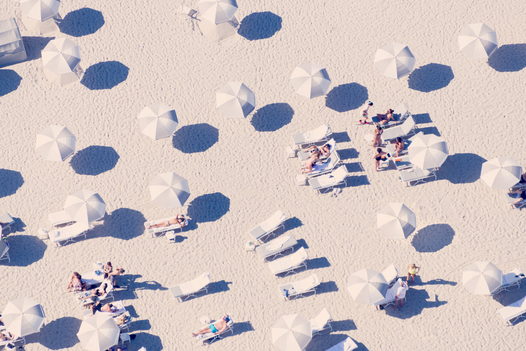 Photography by Gray Malin of Grey and White Striped Umbrellas