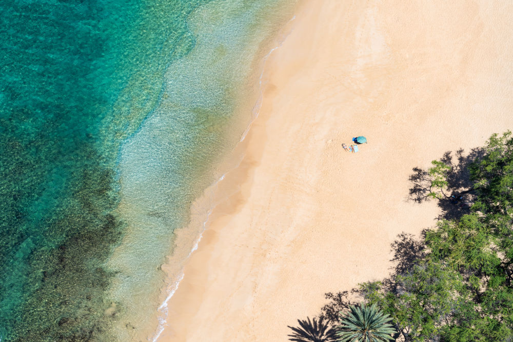 Photography by Gray Malin of Makena Beach Sunbathers, Maui
