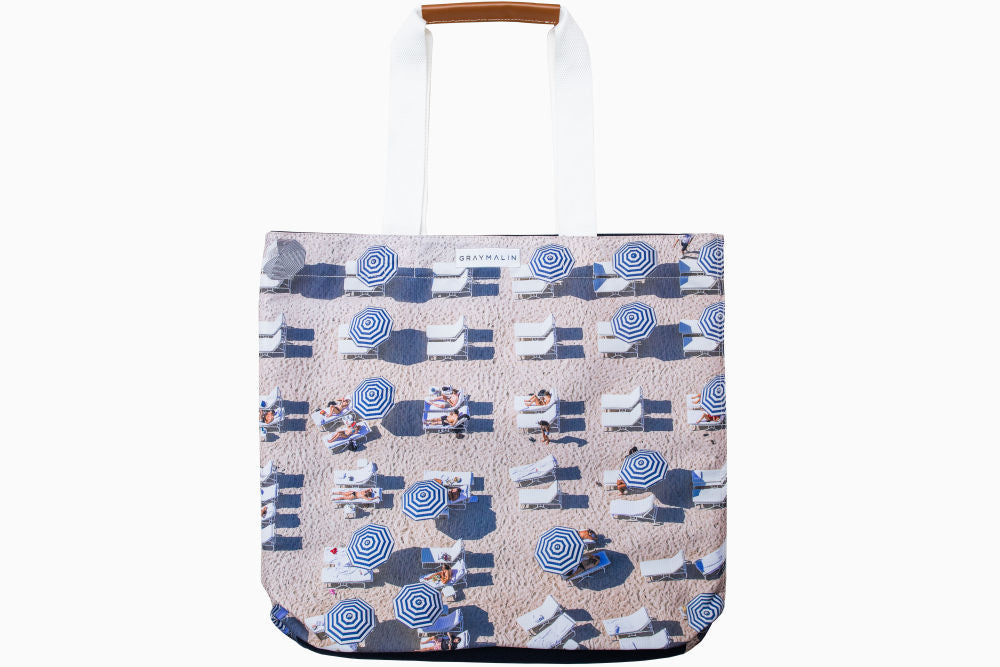 The Navy Striped Umbrellas Tote Bag by Gray Malin
