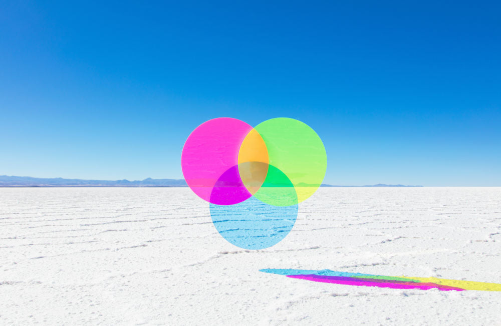 Photography by Gray Malin of Neon Pink, Green, and Blue Circles