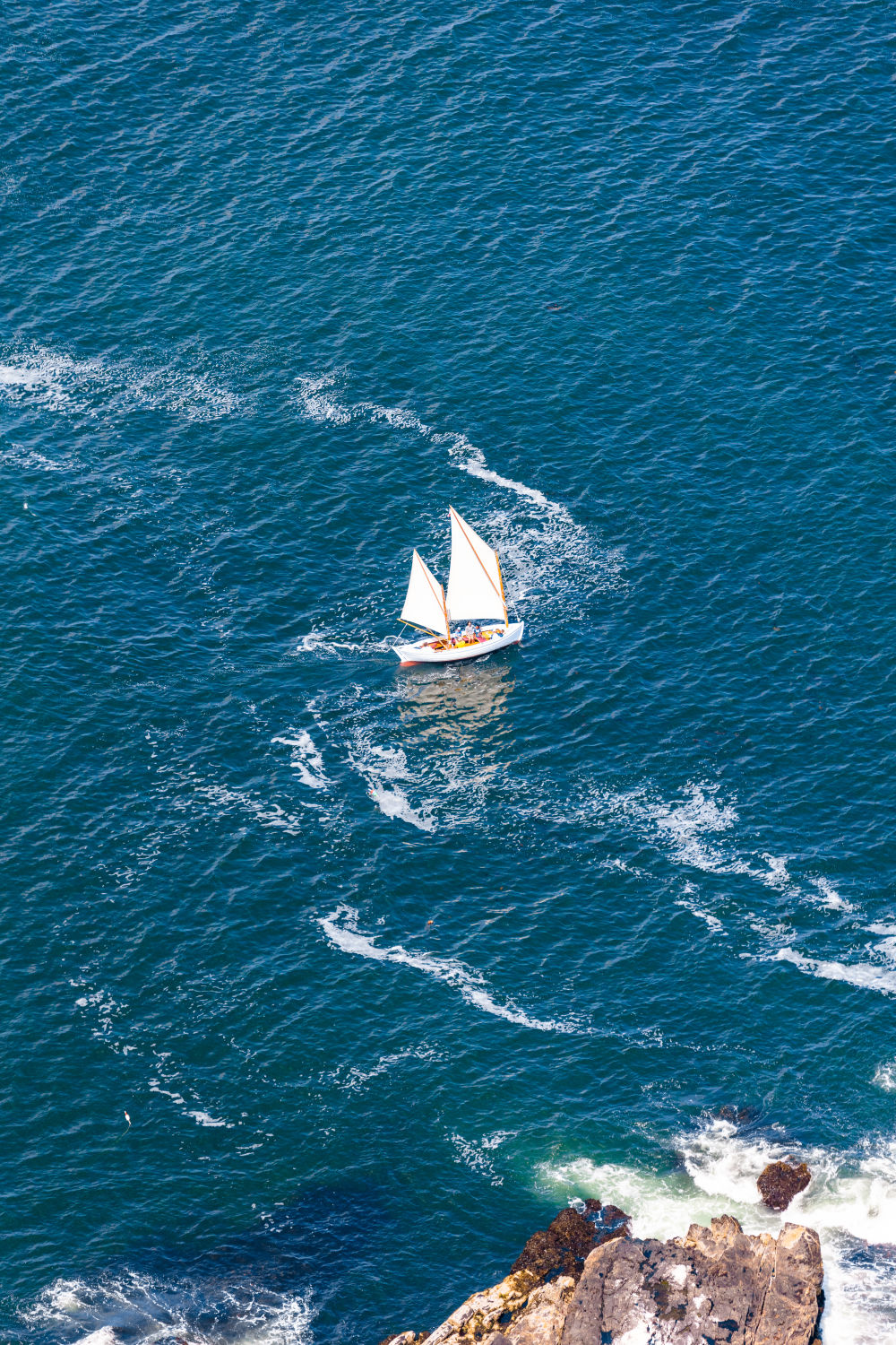 Photography by Gray Malin of Perkins Cove Sailboat, Ogunquit, Maine