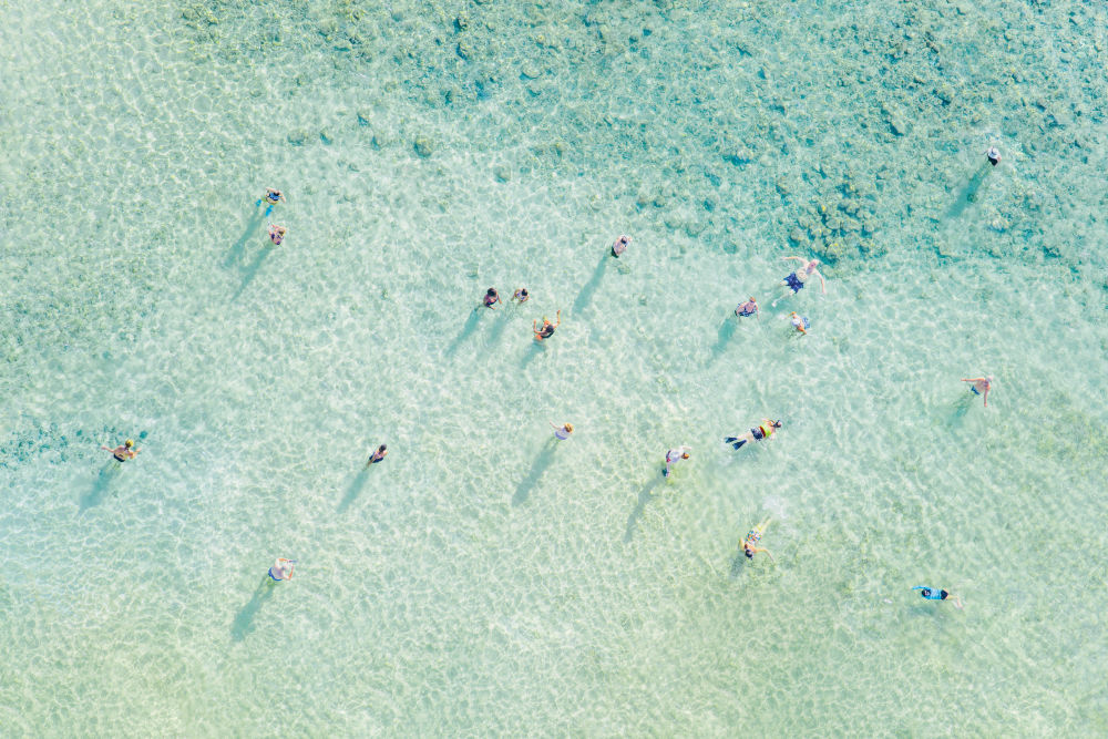 Photography by Gray Malin of Poipu Swimmers, Kauai