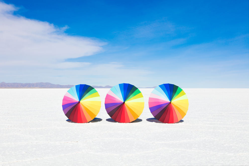 Photography by Gray Malin of Rainbow Umbrellas I