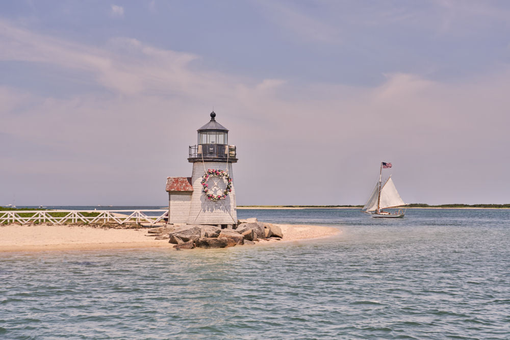 Photography by Gray Malin of Sailing by Brant Point Lighthouse, Nantucket