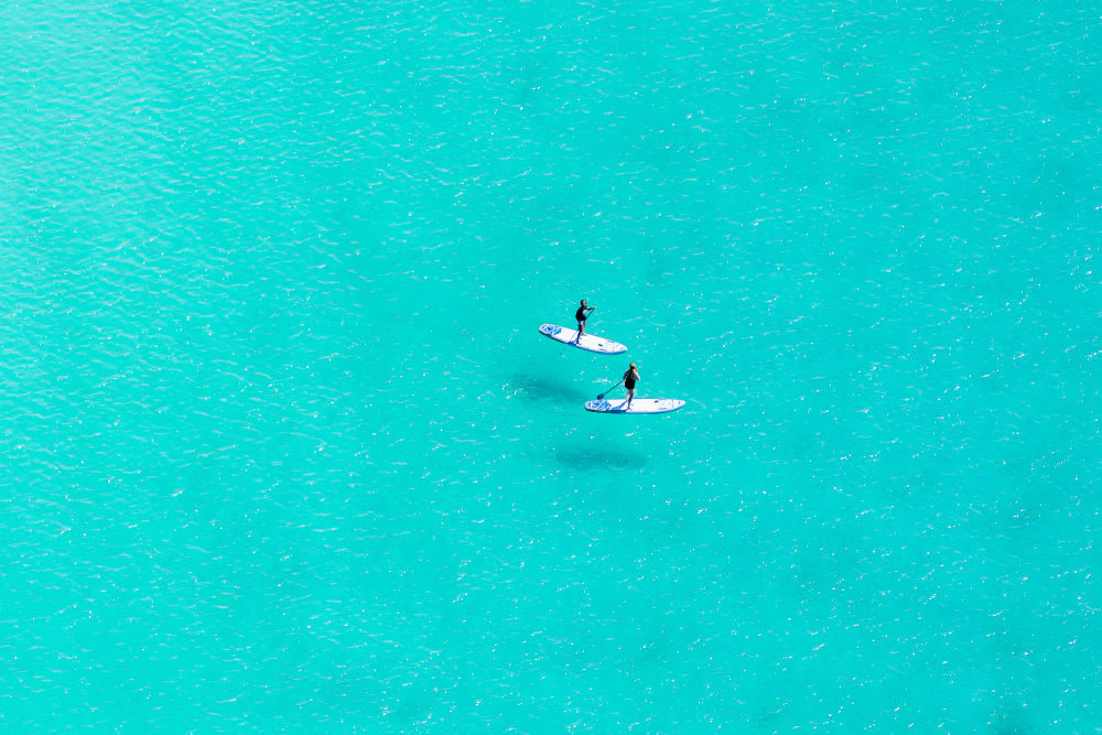 Photography by Gray Malin of Seaside Paddleboarders, 30A Florida