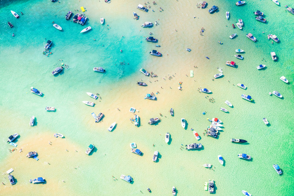 Photography by Gray Malin of The Sandbar, Torch Lake, Michigan