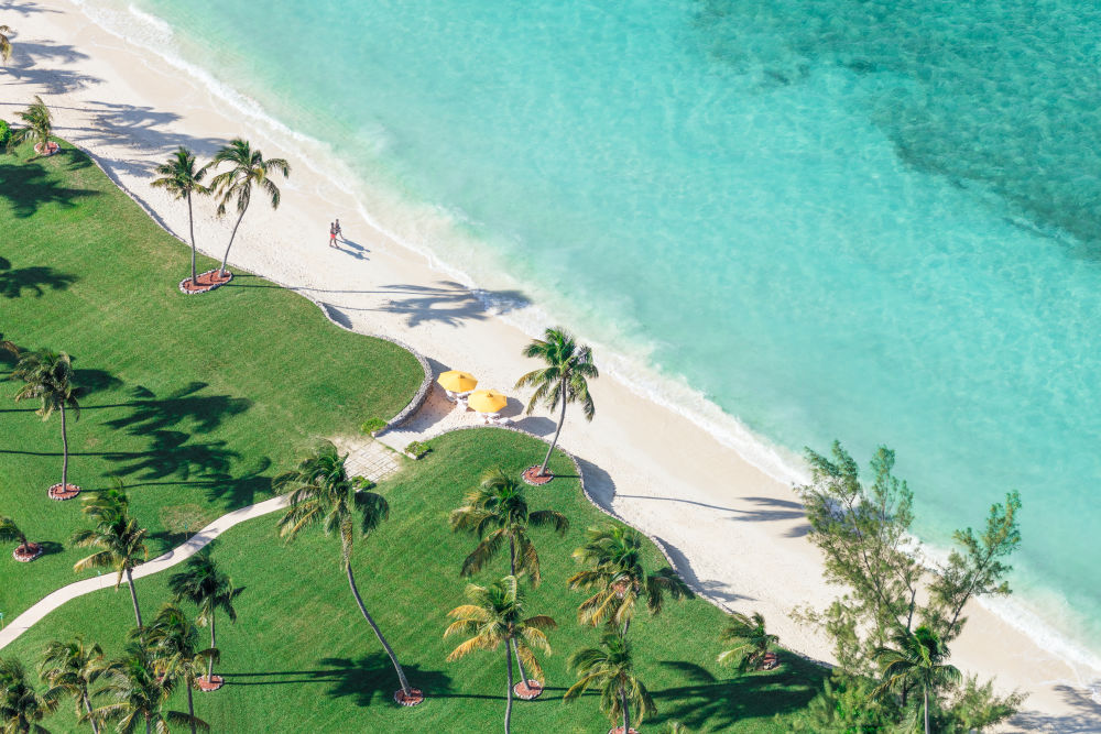 Photography by Gray Malin of Two Yellow Umbrellas, Bahamas