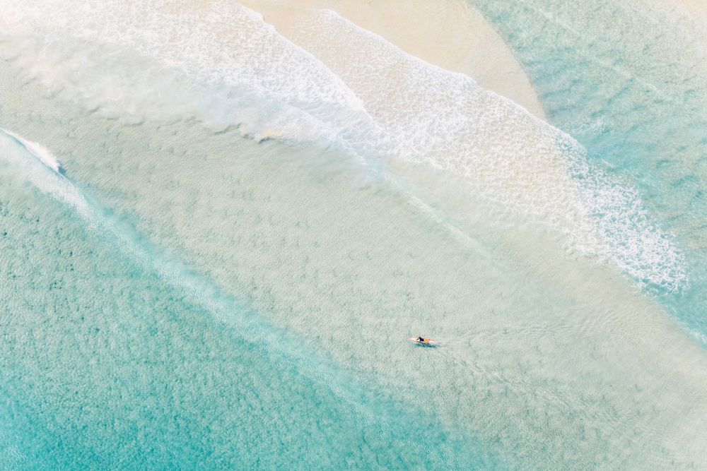 Photography by Gray Malin of Wategos Beach Surfer