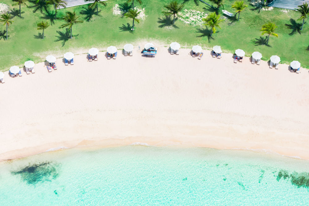 Photography by Gray Malin of White Umbrellas, Eleuthera