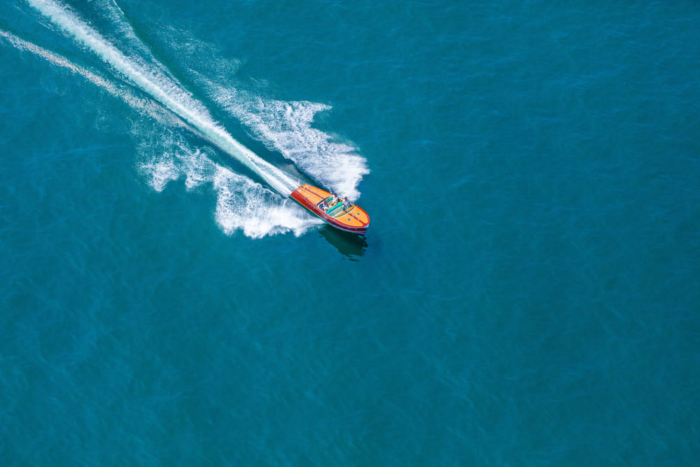 Photography by Gray Malin of Wooden Boat, Lake Como Horizontal