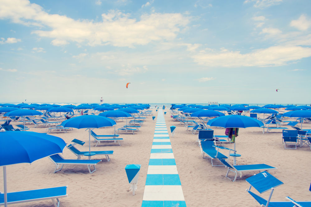 Photography by Gray Malin of Blue and White Striped Path