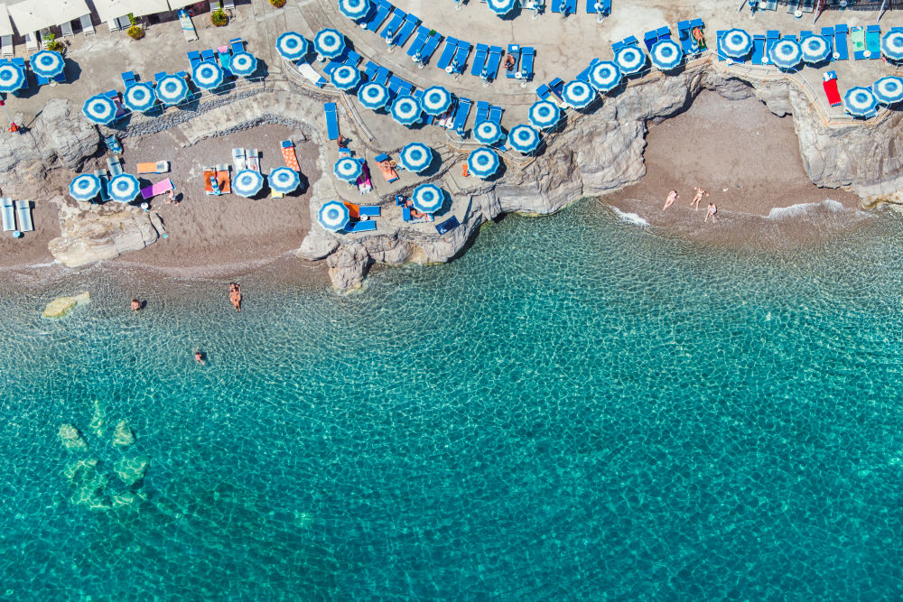 Photography by Gray Malin of Blue Umbrellas, Positano
