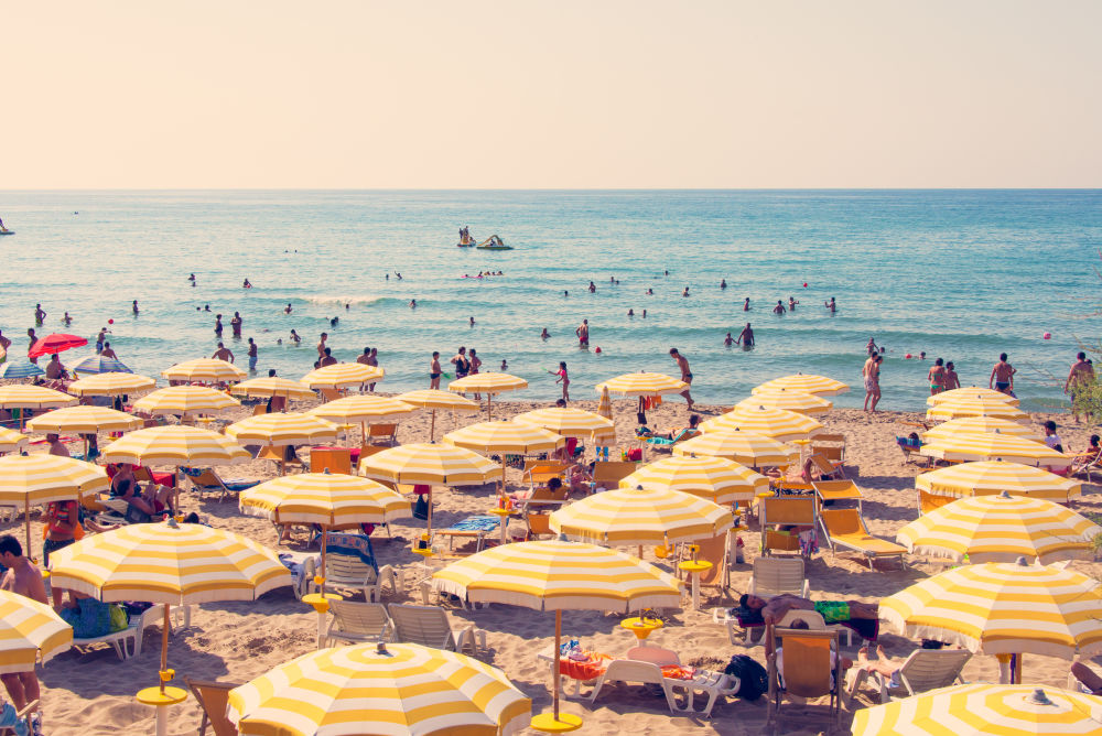 Photography by Gray Malin of Cefalù Yellow Umbrellas