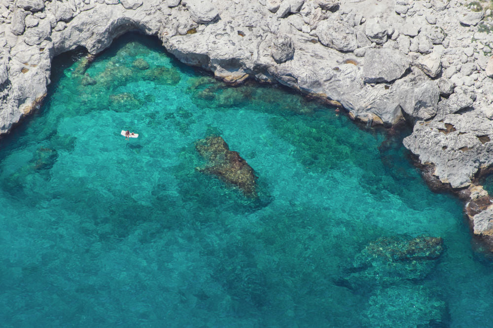 Photography by Gray Malin of Floating Away, Capri