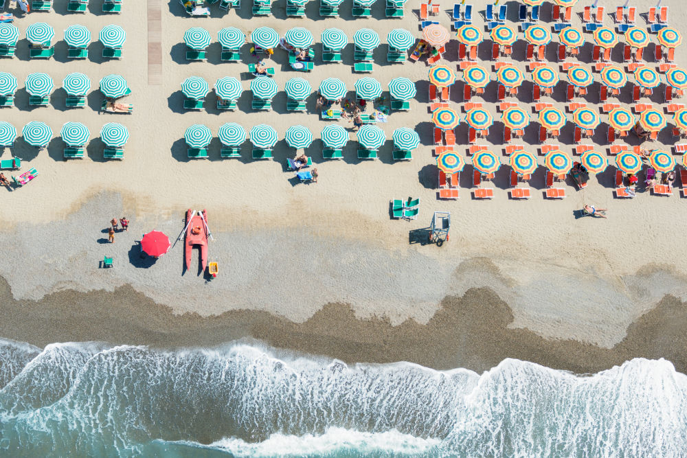 Photography by Gray Malin of Green and Orange Umbrellas, Viareggio
