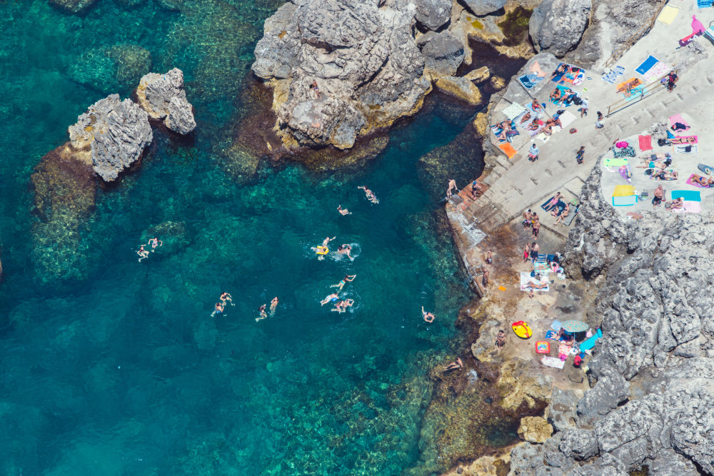 Photography by Gray Malin of Lido del Faro Swimmers, Capri