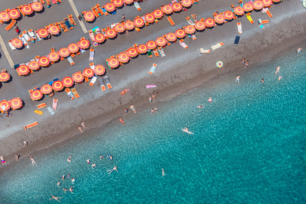 Photography by Gray Malin of Orange Umbrellas, Positano