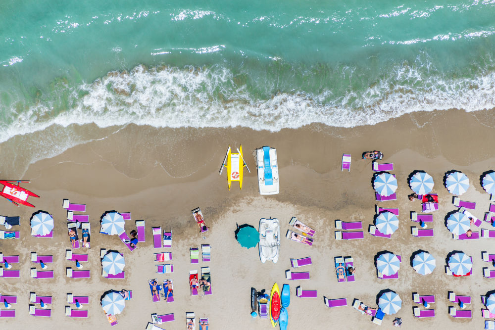 Photography by Gray Malin of Purple Chairs, Rivazzurra