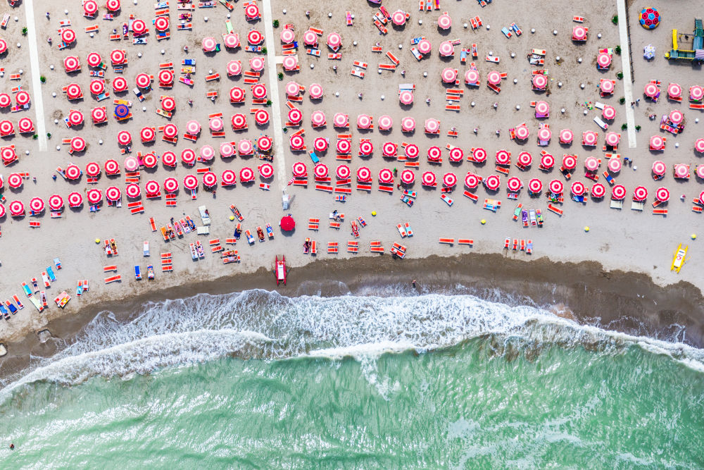 Photography by Gray Malin of Red Umbrellas, Rivazzurra