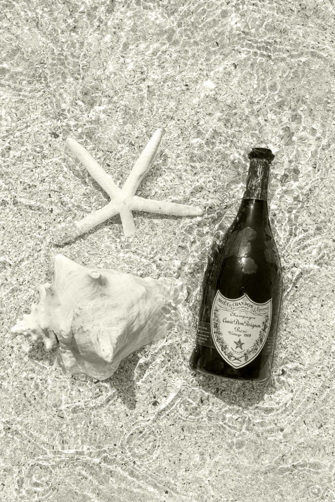 Photography by Gray Malin of Splash of 1969 Dom Perignon, St. Barths (Sepia)