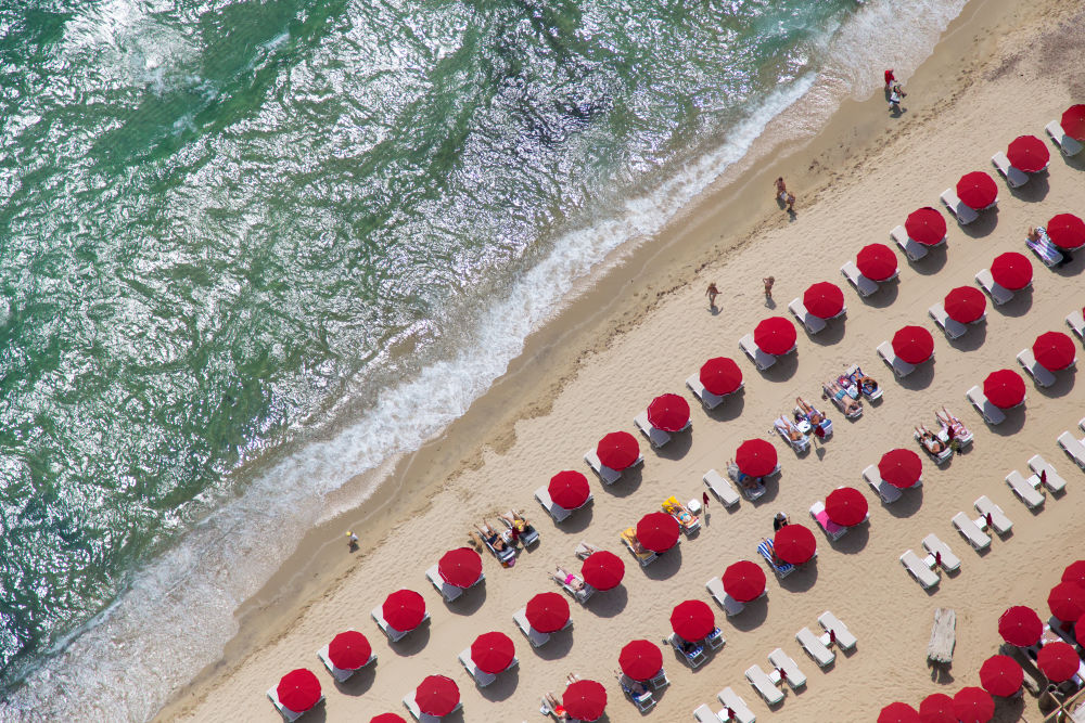 Photography by Gray Malin of St. Tropez Bright Red Umbrellas