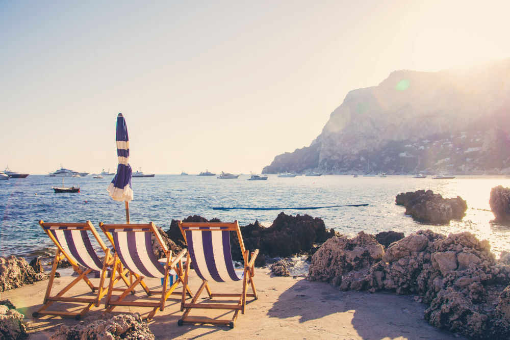 Photography by Gray Malin of Three Chairs, La Fontelina Capri
