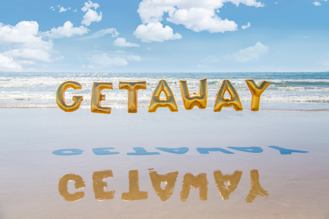 Photography by Gray Malin of Getaway Balloons (Gold)