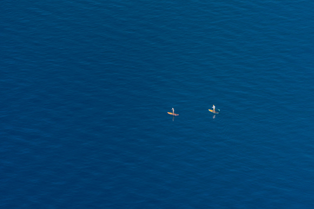 Photography by Gray Malin of Two Paddleboarders, Lake Tahoe