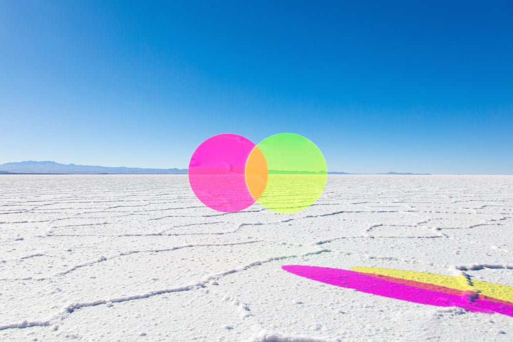 Photography by Gray Malin of Neon Pink and Green Circles