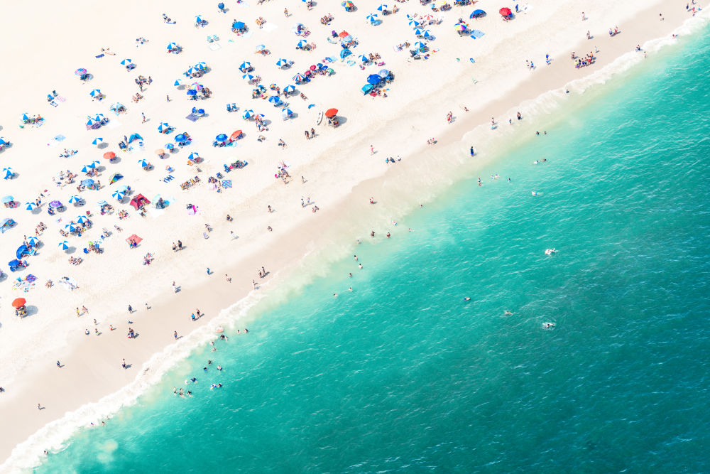 Photography by Gray Malin of Point Pleasant Blue and White Striped Umbrellas, New Jersey