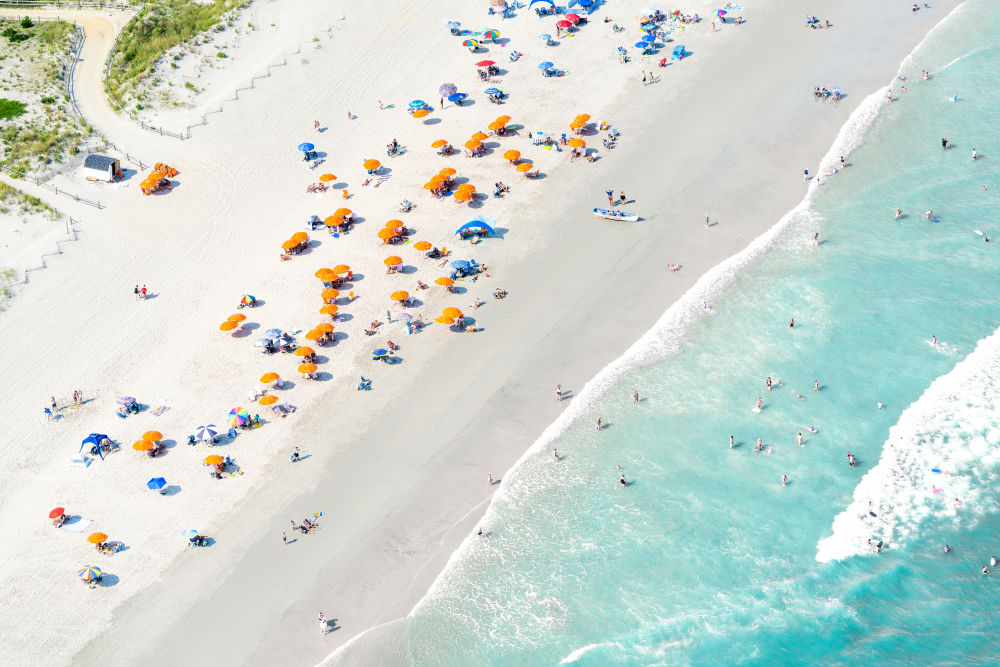 Photography by Gray Malin of Stone Harbor Beach Orange Umbrellas, New Jersey