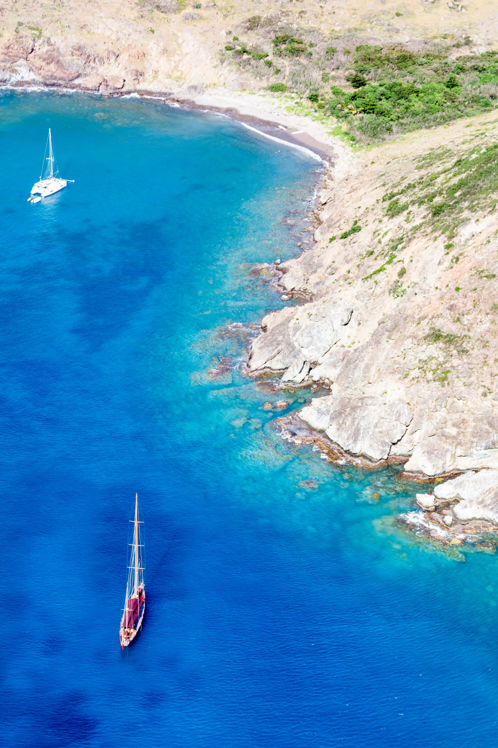 Photography by Gray Malin of Two Sailboats, St. Barths