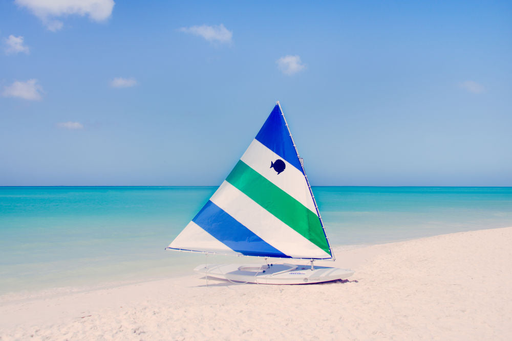 Green and Blue Striped Sailboat